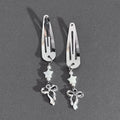Silver metal alloy star bow hair clip with electroplated finish on neutral background