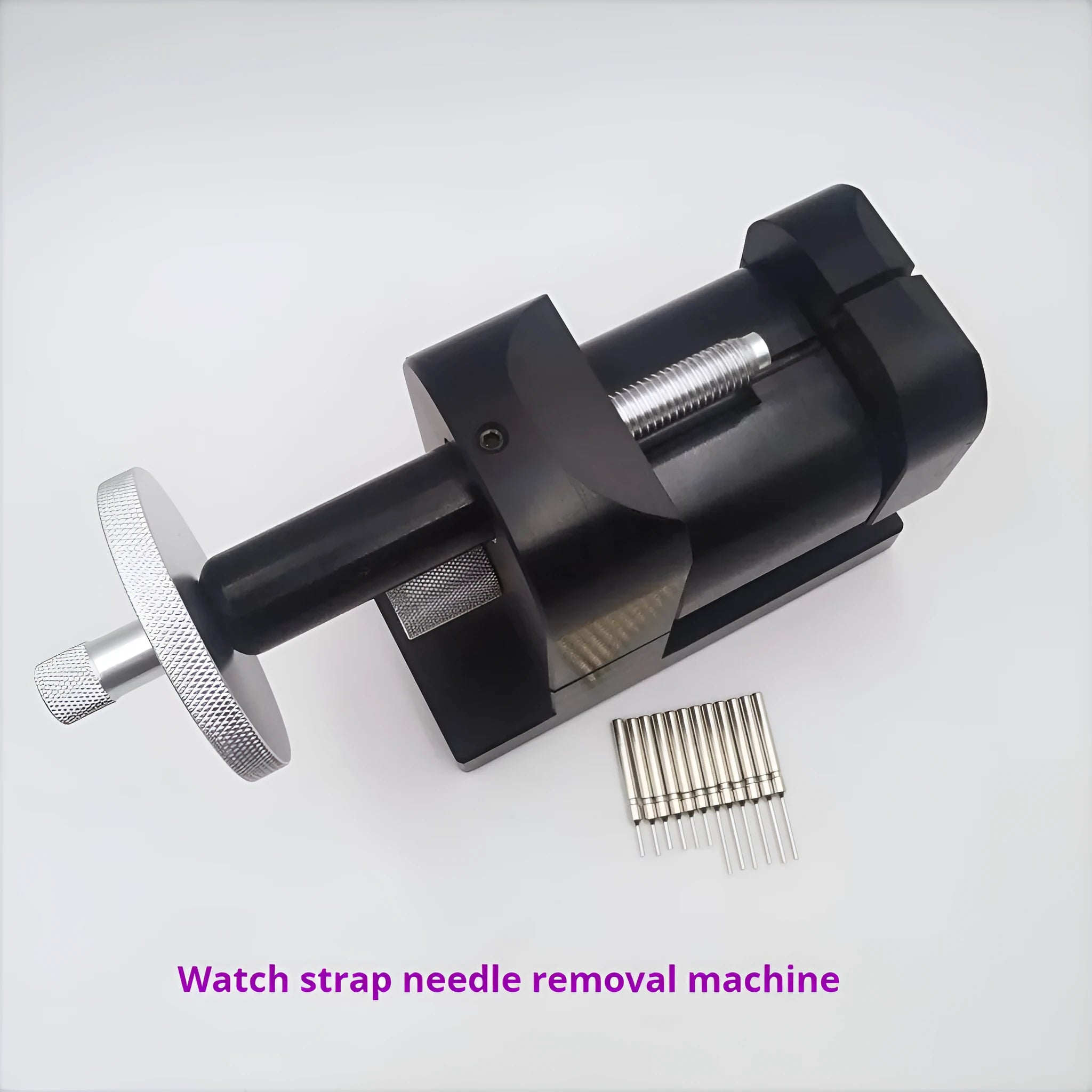 Alloy steel watch strap stripping machine tool for watch repair on a workbench.