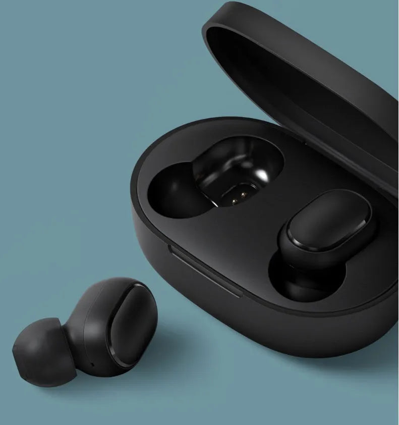 Black Redmi AirDots true wireless earbuds and charging case on a white background.
