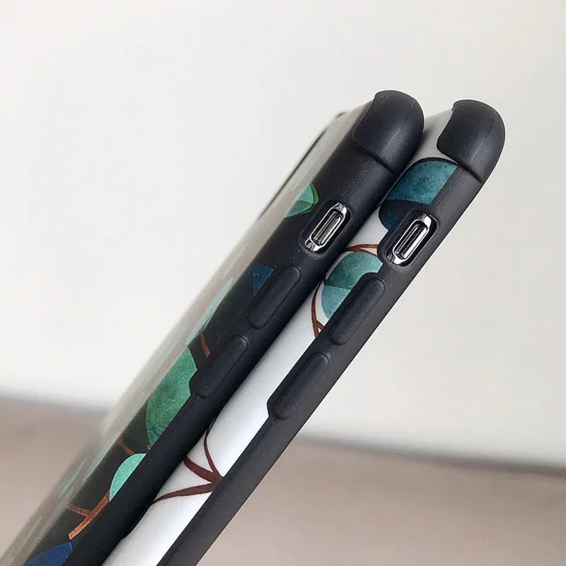 Black silicone leaf pattern phone case shown fitted on an iPhone.