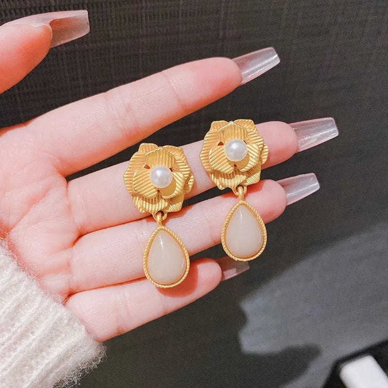 Gold colour stud earrings with ice flower pattern, rose pearl design, and central opal stone