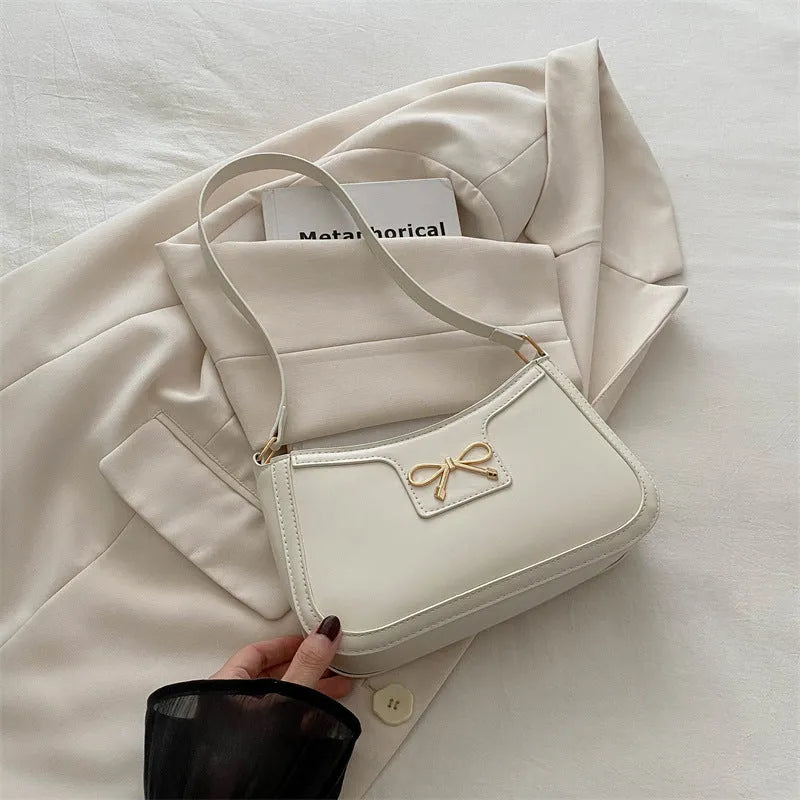 PU leather shoulder bag with bow detail in horizontal square shape showing rose red colour option