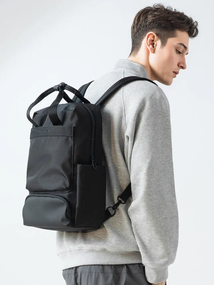 Elegant black Oxford cloth computer backpack with 20-35 litre capacity and polyester lining