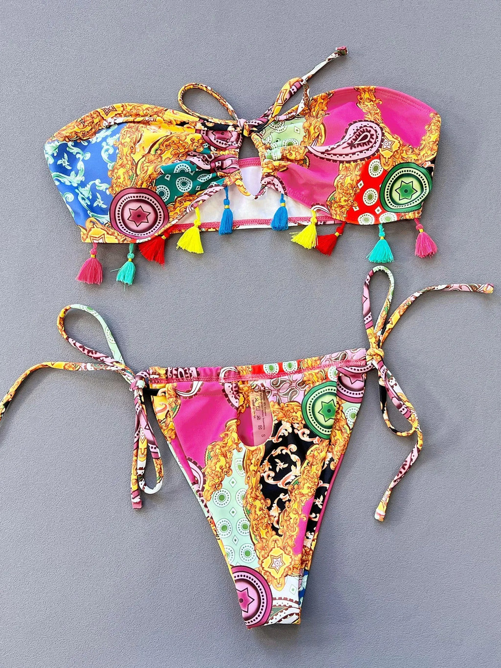 Women's printed separated swimwear bikini set with tube top and briefs on a mannequin