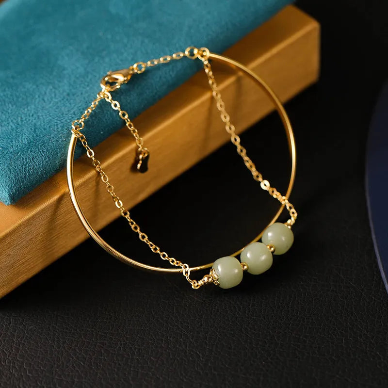 Jade lucky beads bracelet for women with gold inlay detailing showing single, double and three beads versions
