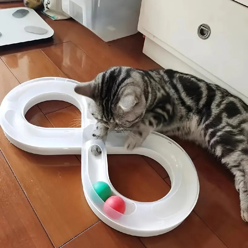 Blue and white cat interactive toy with turntable track ball and teasing stick on flat surface