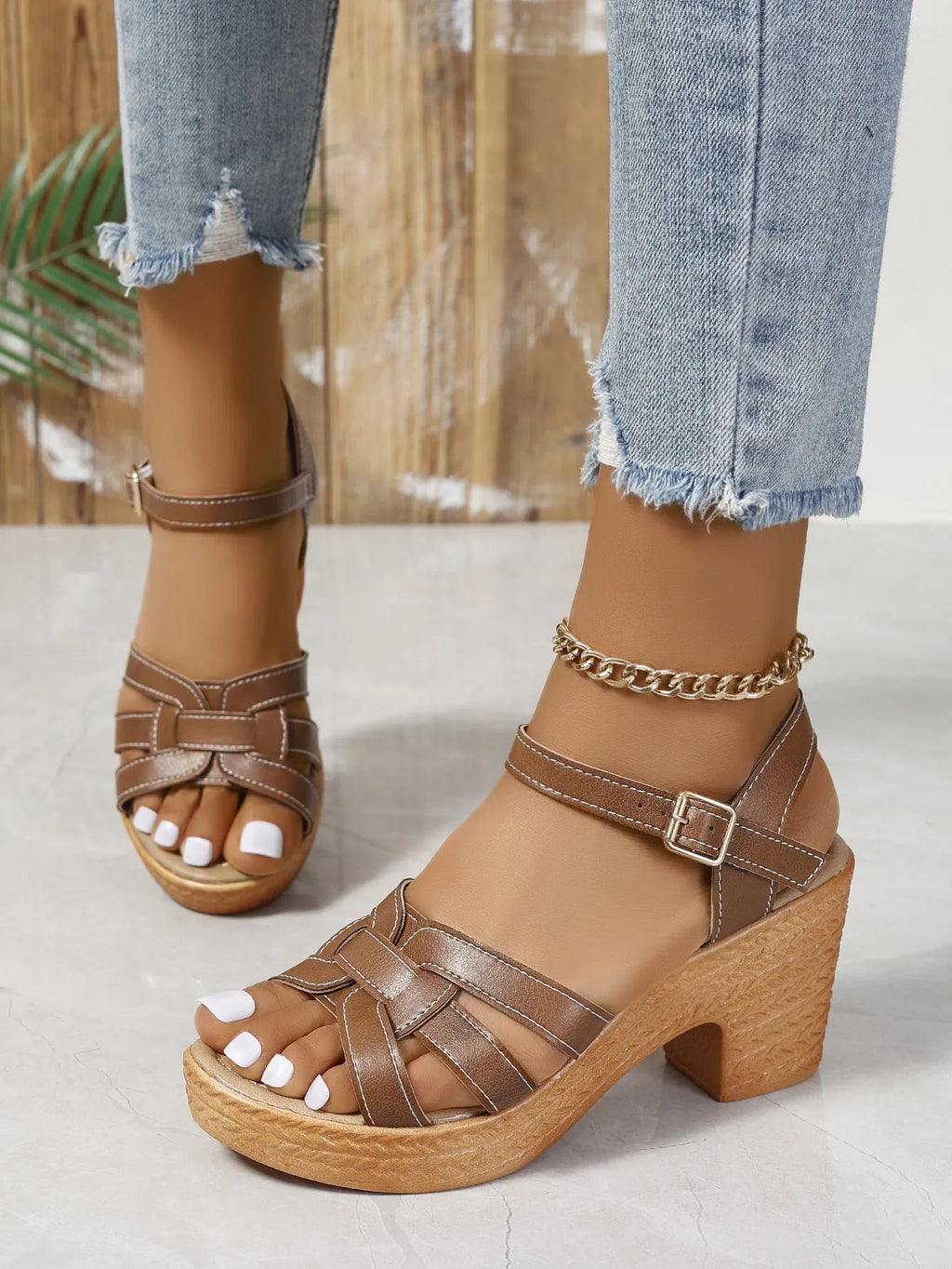 Plus size black peep toe women's sandals with a chunky heel and ankle buckle strap.