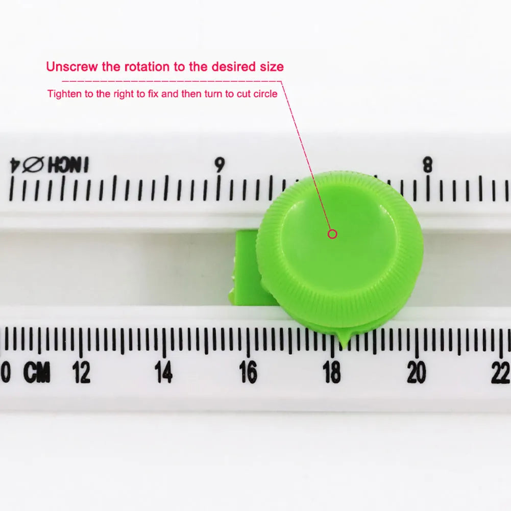 Orange and green plastic round paper cutter for A3 sheets on a table.
