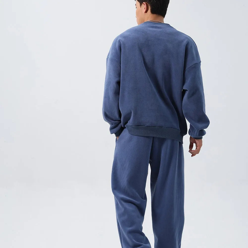 Men's polar fleece winter sports suit with long sleeve top and trousers in multiple colours.