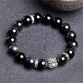 Natural obsidian bead bracelet with silver 999 details, showing male 12mm and female 10mm size options.
