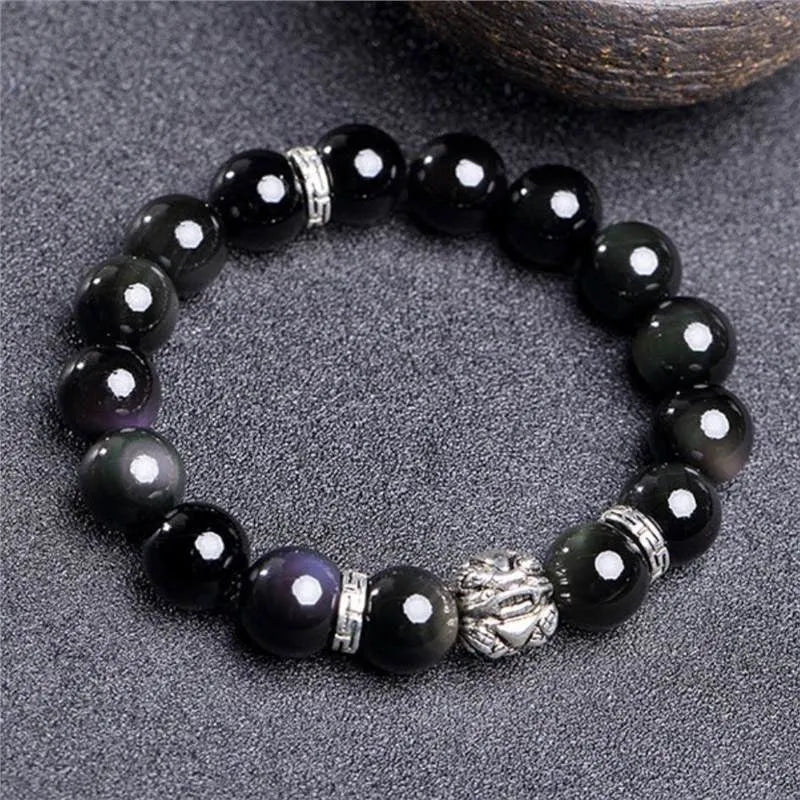 Natural obsidian bead bracelet with silver 999 details, showing male 12mm and female 10mm size options.