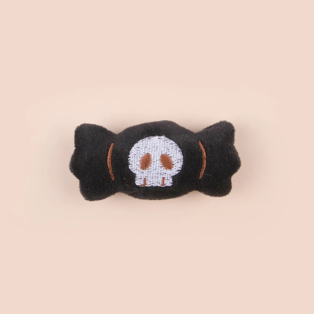 Small plush cat teaser toy with colourful candy or skull design on string
