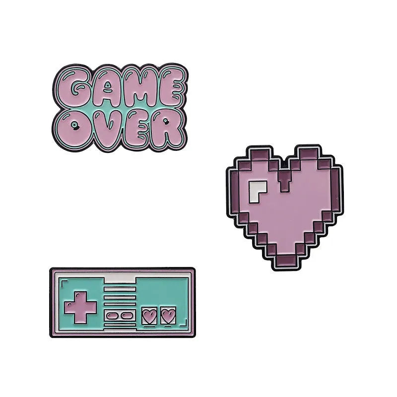 Stereo game console badge pin made from alloy metal on a bag, showing three colour variant options.