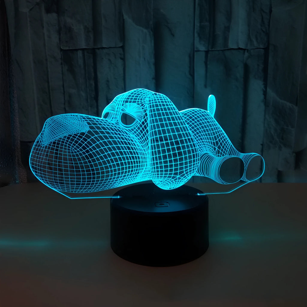 Doggo Desktop Lamp showing 3D dog illusion glowing in blue light on a desk