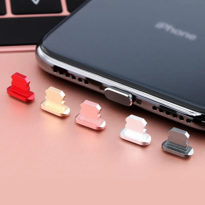 Aluminium alloy dust plug for iPhone charging port in various colours including gold, silver and rose gold.
