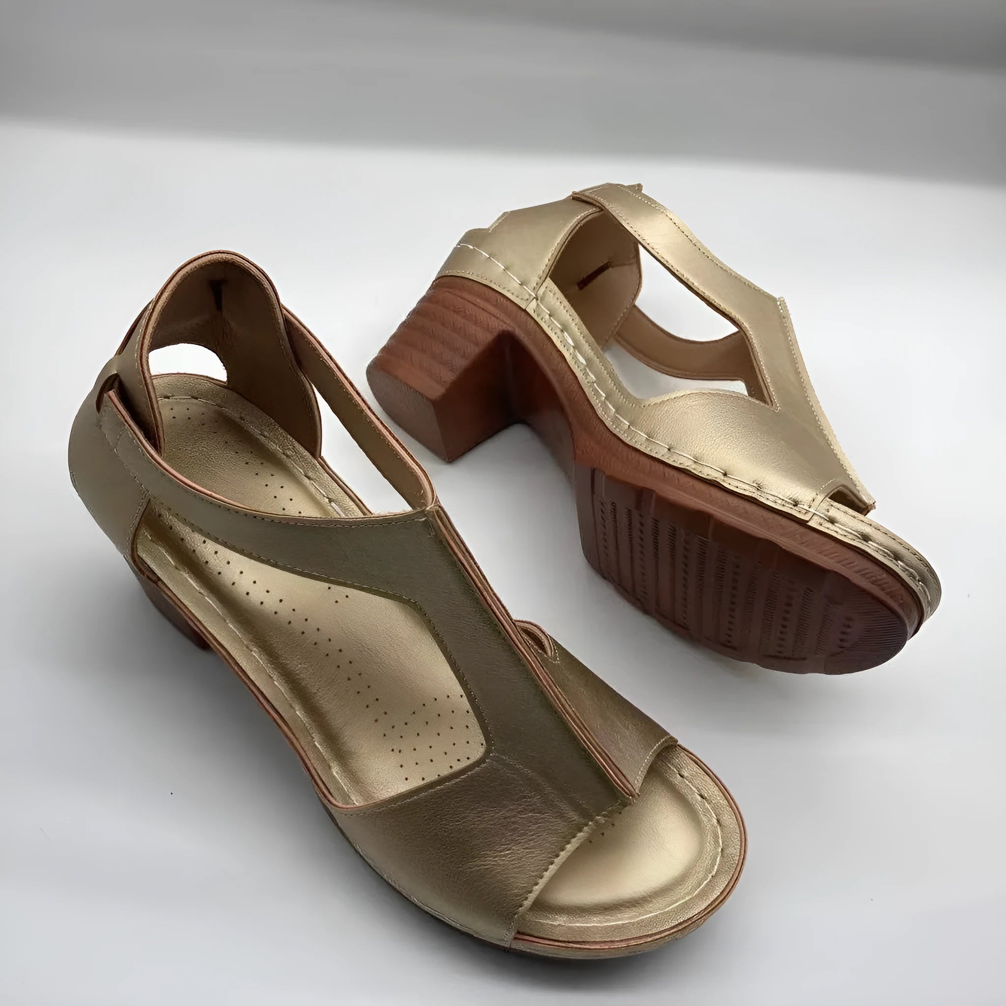Roman style women's wedge sandals with open peep toe, buckle detail, and a low heel, shown in multiple colours.