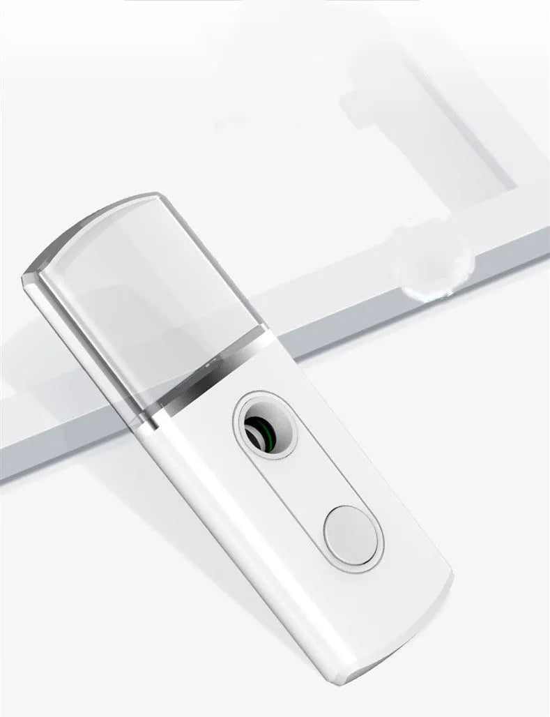 Portable facial nano mist humidifier in white with 20ml tank and compact 10cm body