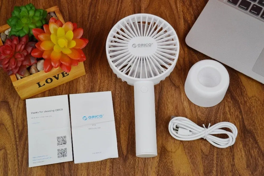 White ORICO FH1 USB rechargeable portable handheld and desktop fan with fine-line detailing.