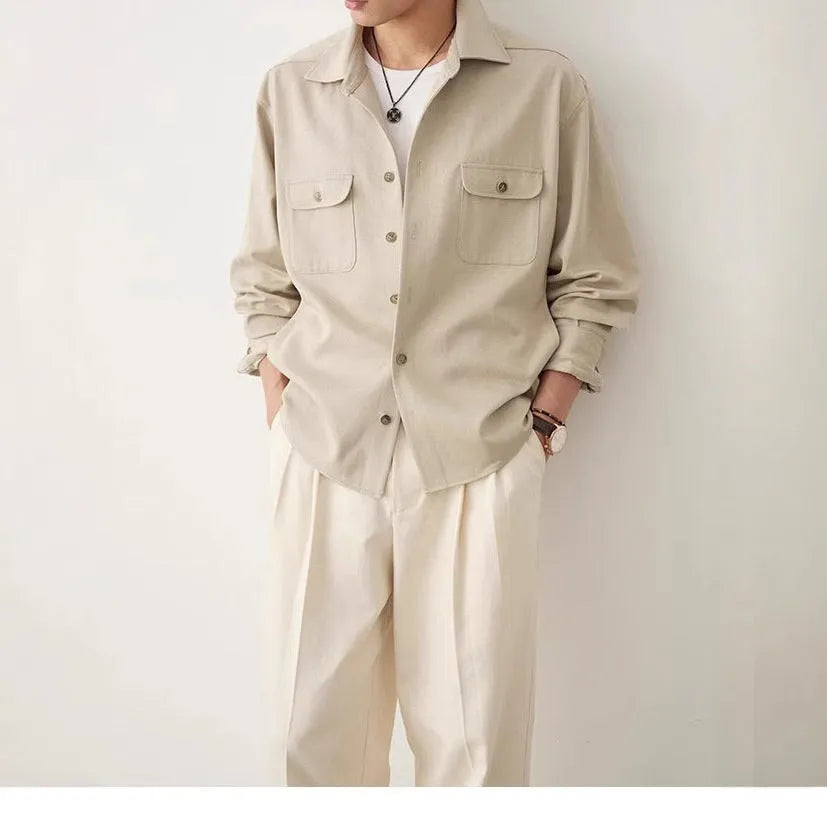 Men's simple profile cotton lapel shirt in light sand rice colour, showing long sleeves and collar detail.