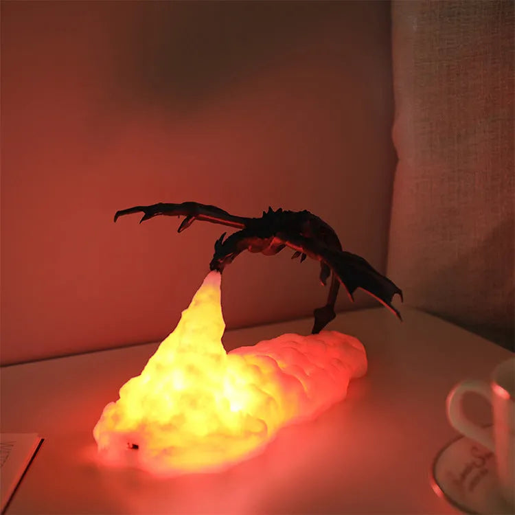 3D printed dragon lamp glowing with warm red light, showing detailed fire dragon design on a table.