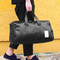 Black waterproof sports bag with separate shoe compartments and diagonal straps in two size options.