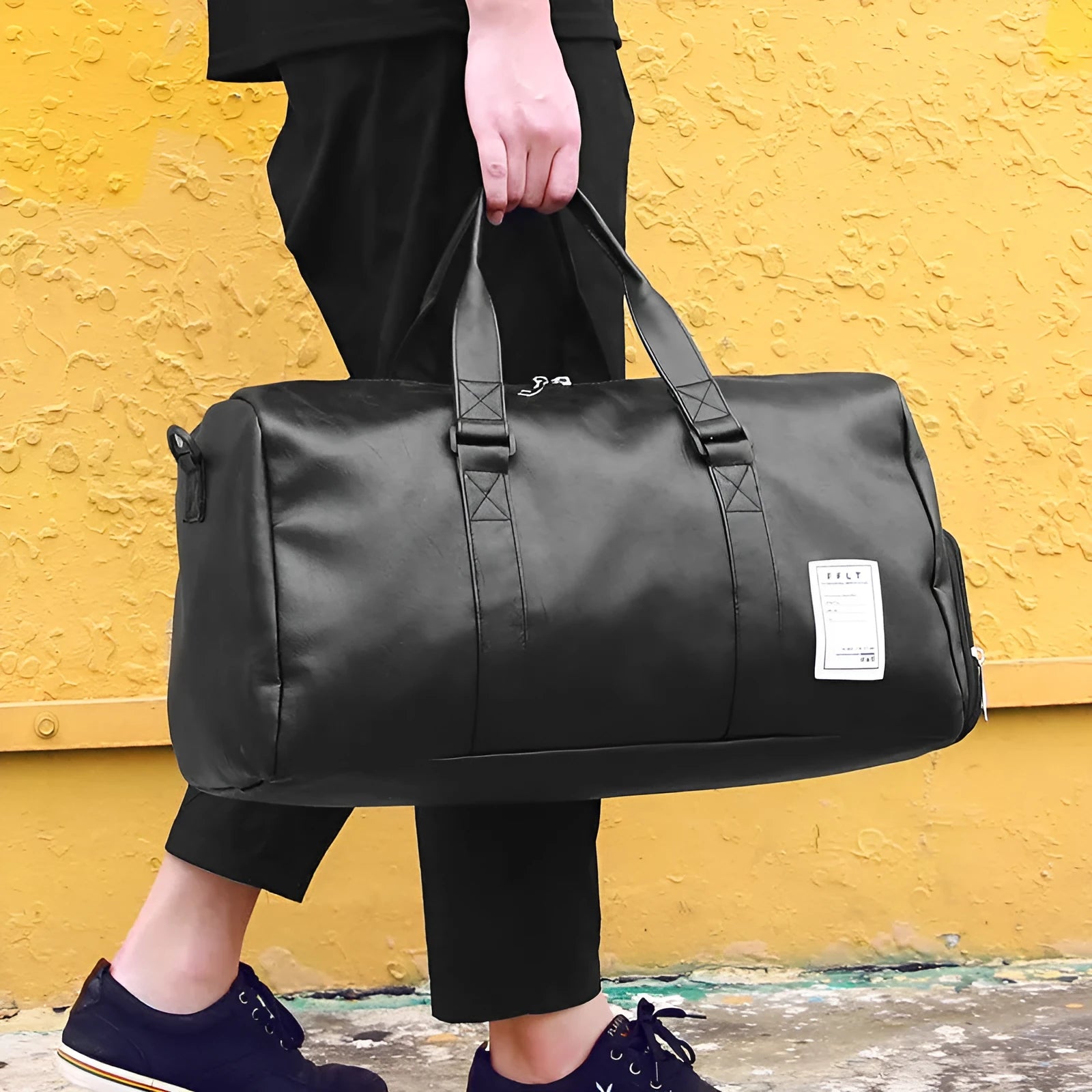 Black waterproof sports bag with separate shoe compartments and diagonal straps in two size options.
