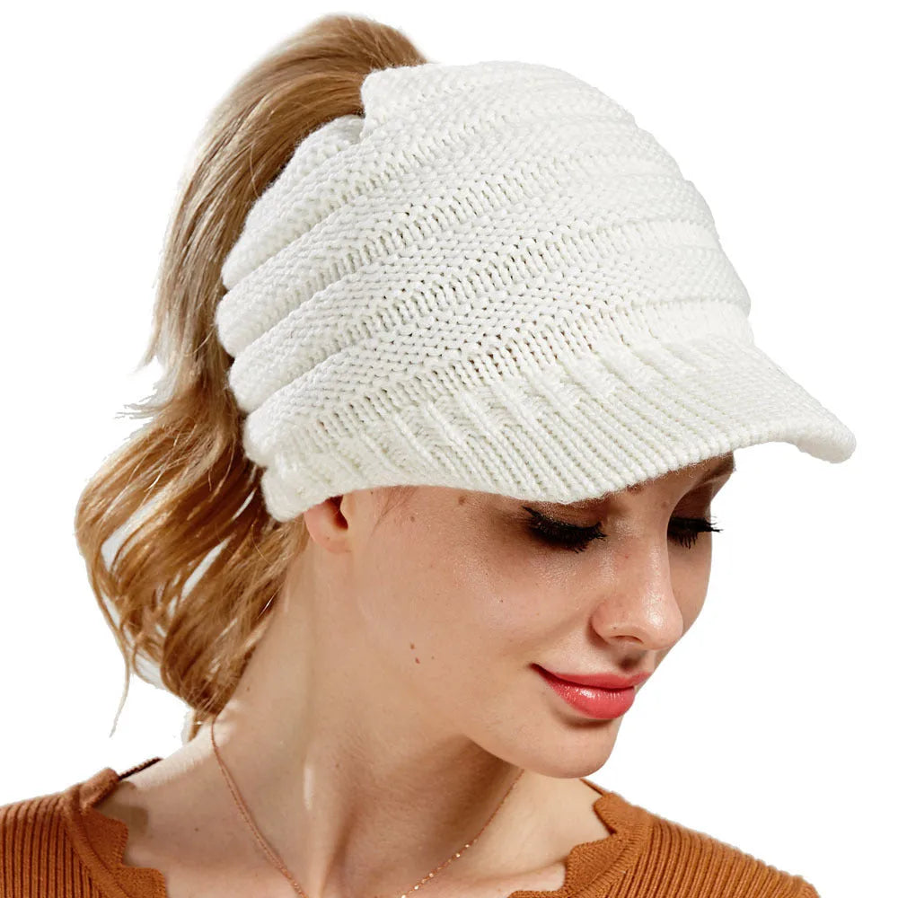 Women's acrylic ponytail beanie with back opening showing hairstyle accommodation