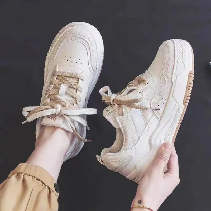 Low top rubber sneakers in pink and milky white with height-increasing design