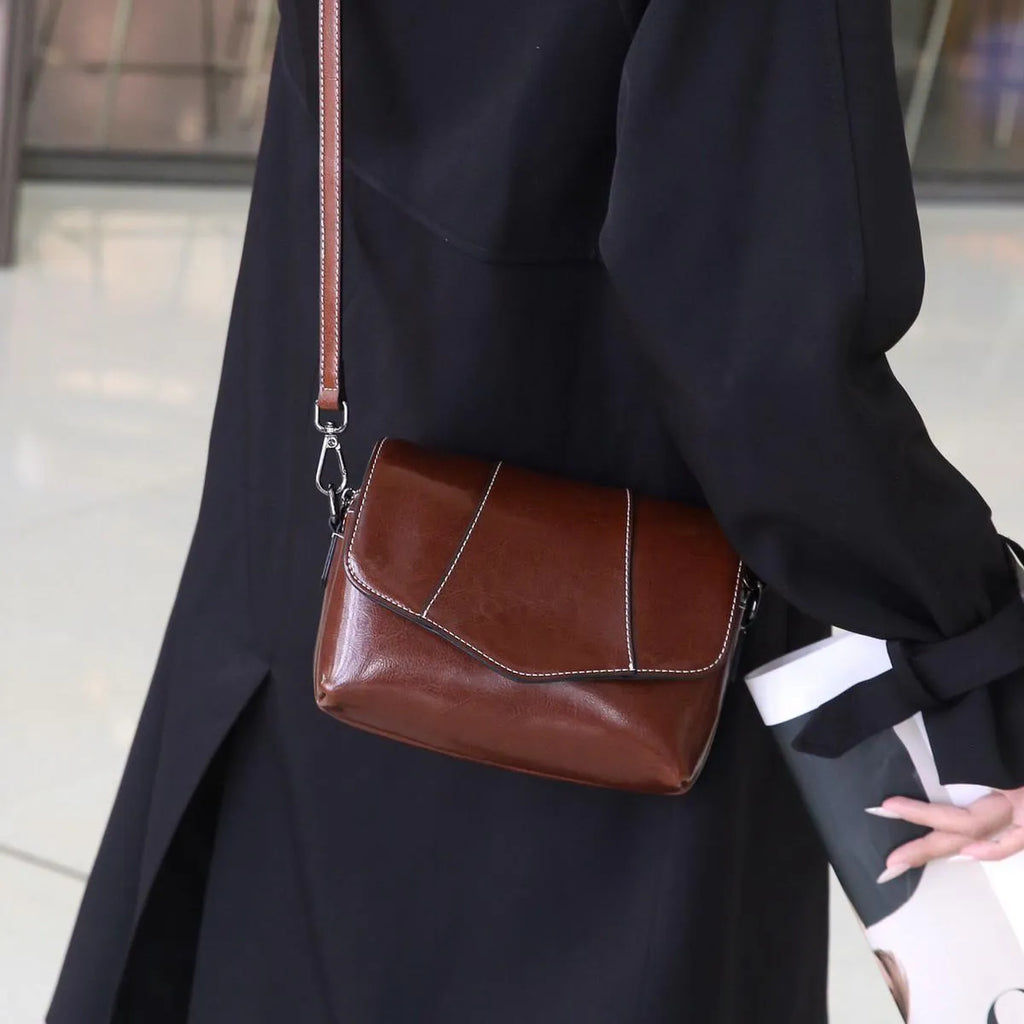 Top grain leather crossbody bag for women in caramel colour with zip closure and patchwork design