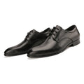 Men's black leather derby shoes with a pointed toe and rubber sole on a neutral background.