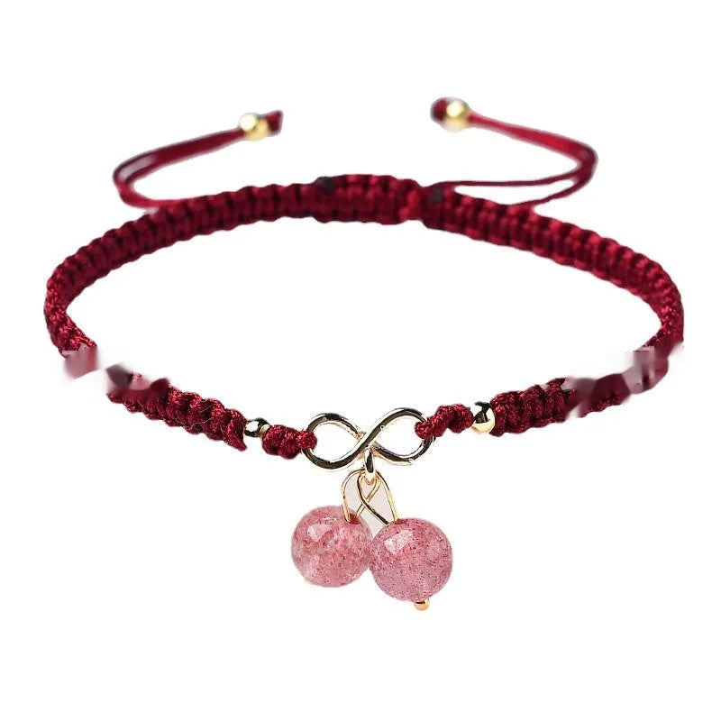Natural strawberry quartz cherry bracelet for women on adjustable elastic cord, showing fruit-shaped crystal design.