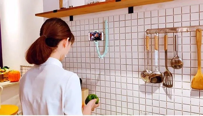 Flexible rubber phone holder with suction cup base showing 360 degree rotation capability