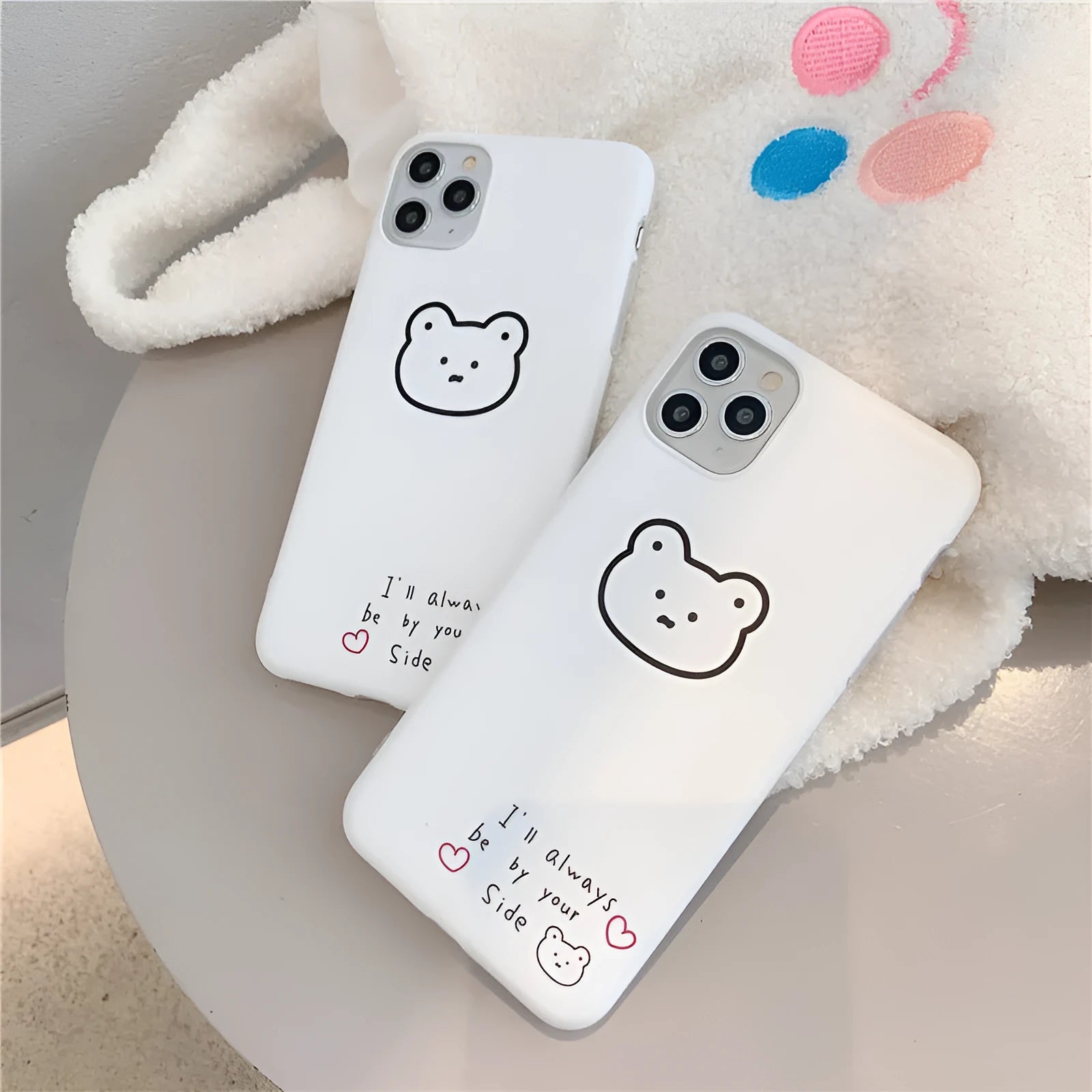 Silicone iPhone back cover case featuring a cartoon Korean bear design, shown on a mobile phone.