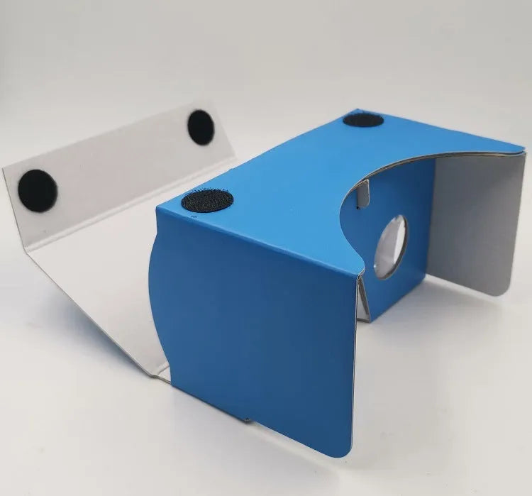 Pink and white cardboard VR glasses with rubber head strap and magnetic button for smartphones.