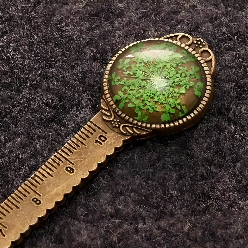Handmade dried flower bookmark with ruler showing lace flowers, daffodils, and clover at 12cm length