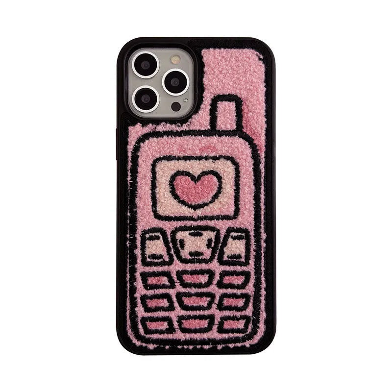 Pink towel embroidered soft TPU back cover case for iPhone models on a table.