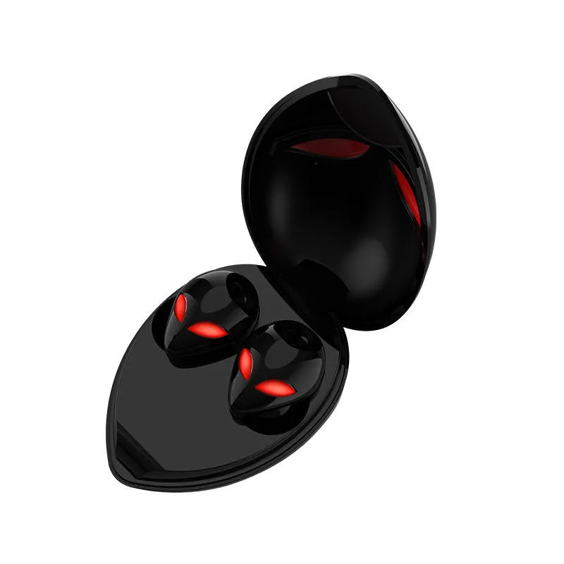 Creative Outer T8 Starman alien-design Bluetooth earbuds with red LED lights and wireless charging case.