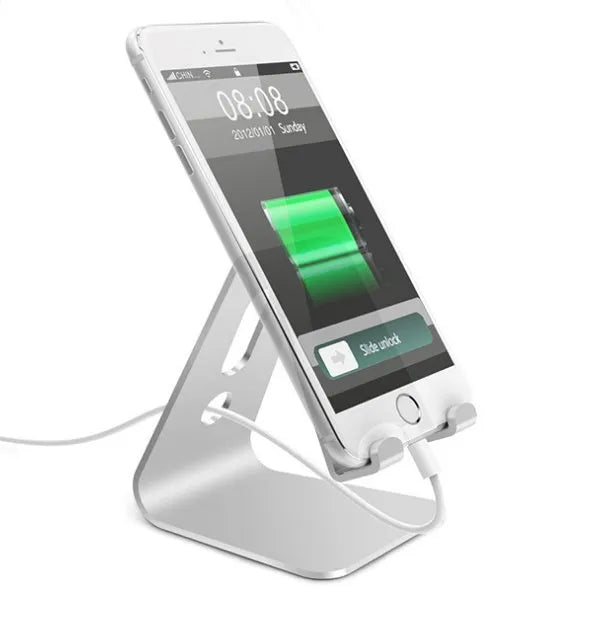 Aluminium alloy universal phone and tablet mount in silver colour on a wooden desk.