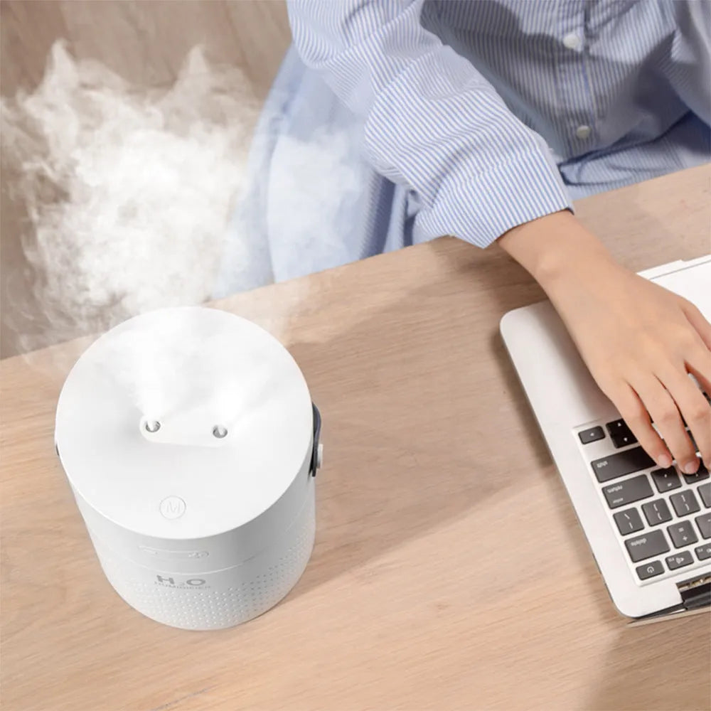 Green USB rechargeable bedroom humidifier with 1.1 litre water tank on a wooden surface