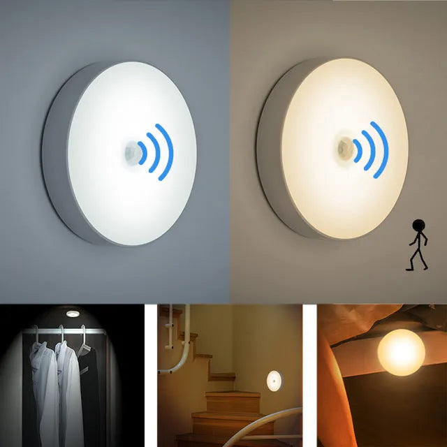 Small white circular USB rechargeable motion sensor LED night light with adhesive backing.