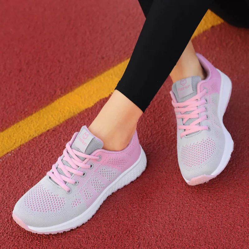 Women's white high top flat shoes with tide net design and back lacing on an EVA sole.