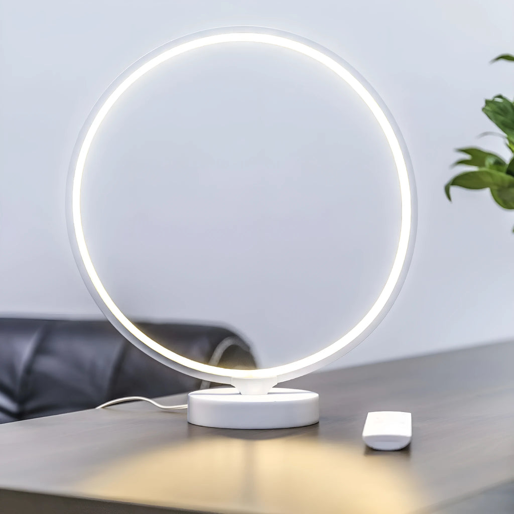3D Full Moon Lamp on a table showing detailed lunar surface texture, with remote control for colour adjustment.