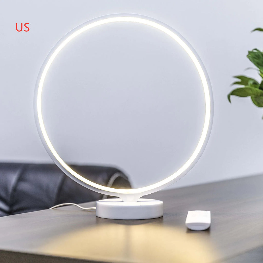 3D Full Moon Lamp on a table showing detailed lunar surface texture, with remote control for colour adjustment.