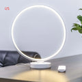 3D Full Moon Lamp on a table showing detailed lunar surface texture, with remote control for colour adjustment.