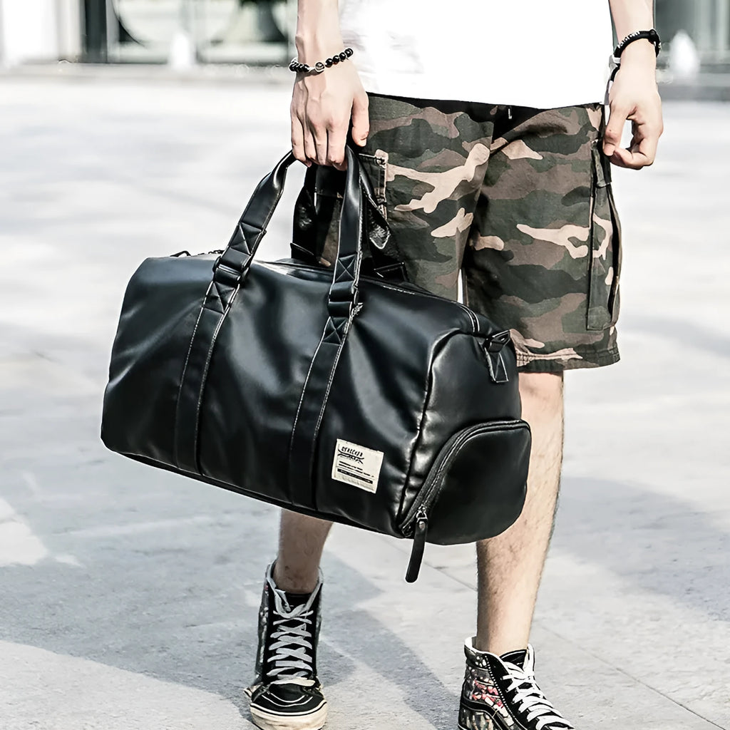 Black waterproof PU leather gym sports training bag showing internal laptop and camera compartments