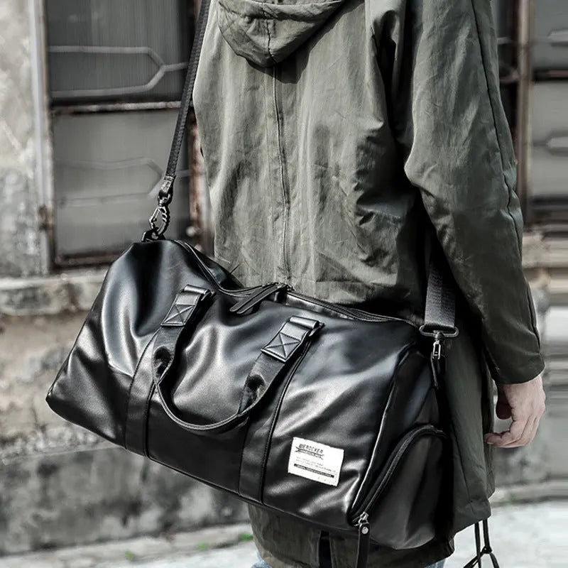 Black waterproof PU leather gym sports training bag showing internal laptop and camera compartments