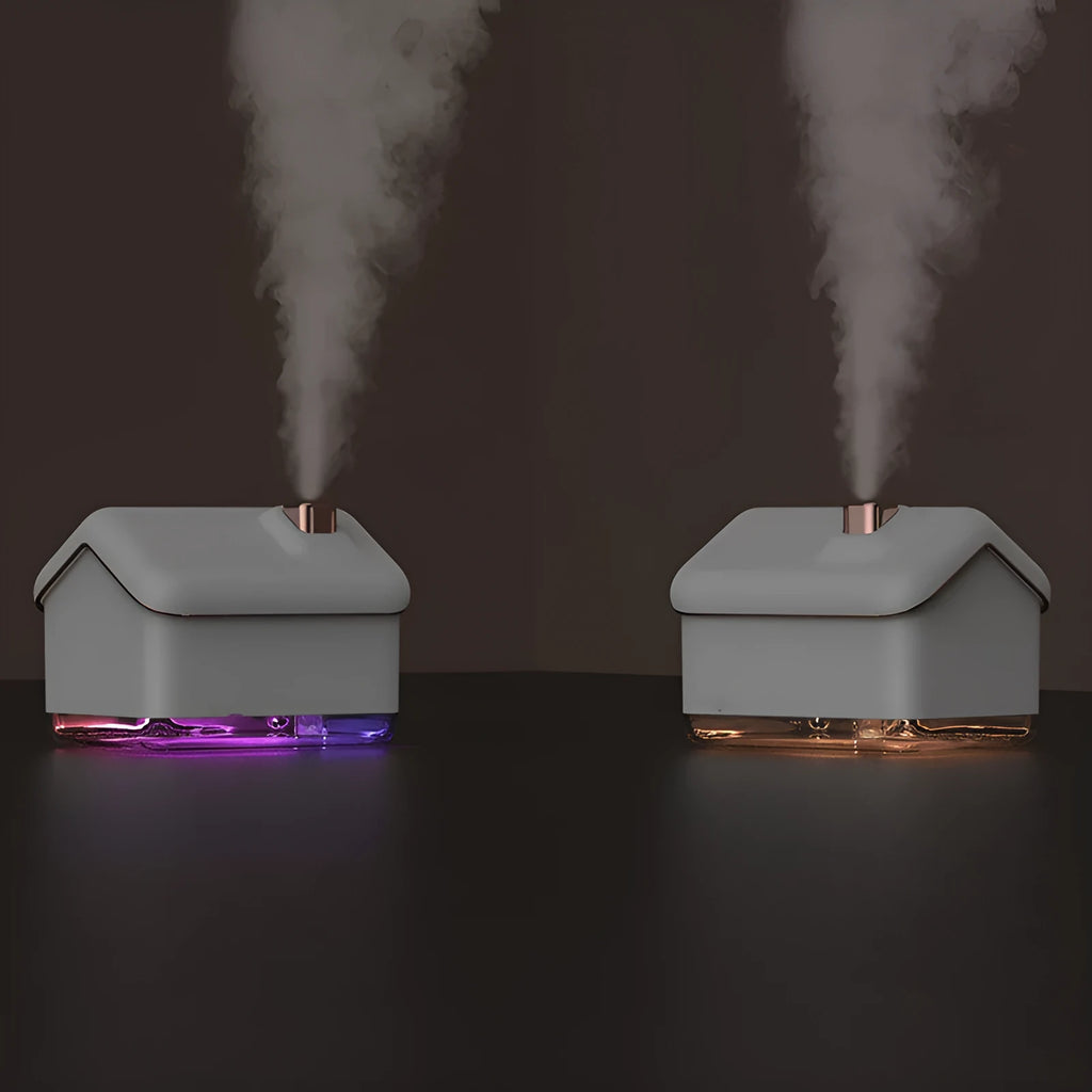 White igloo-shaped ultrasonic humidifier and essential oil diffuser with LED light on wooden table