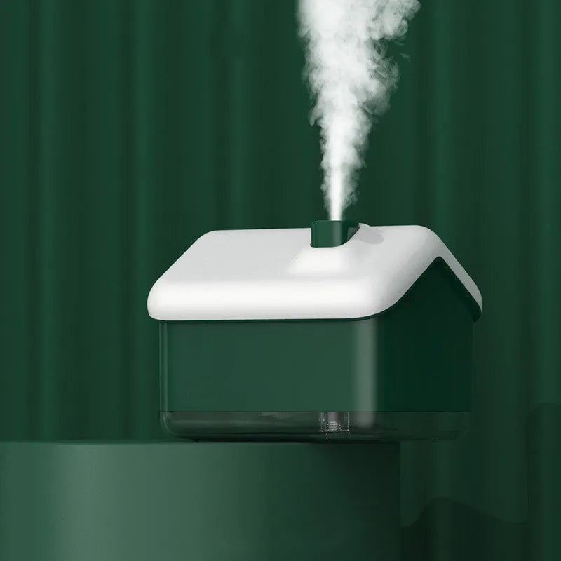 White igloo-shaped ultrasonic humidifier and essential oil diffuser with LED light on wooden table
