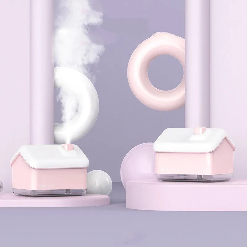 White igloo-shaped ultrasonic humidifier and essential oil diffuser with LED light on wooden table