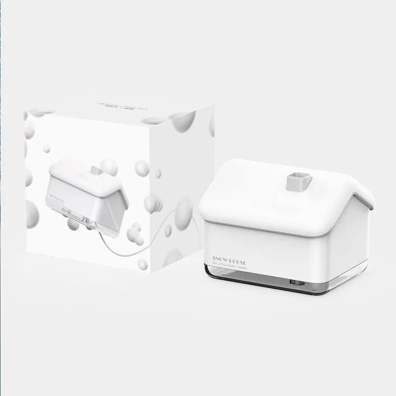 White igloo-shaped ultrasonic humidifier and essential oil diffuser with LED light on wooden table